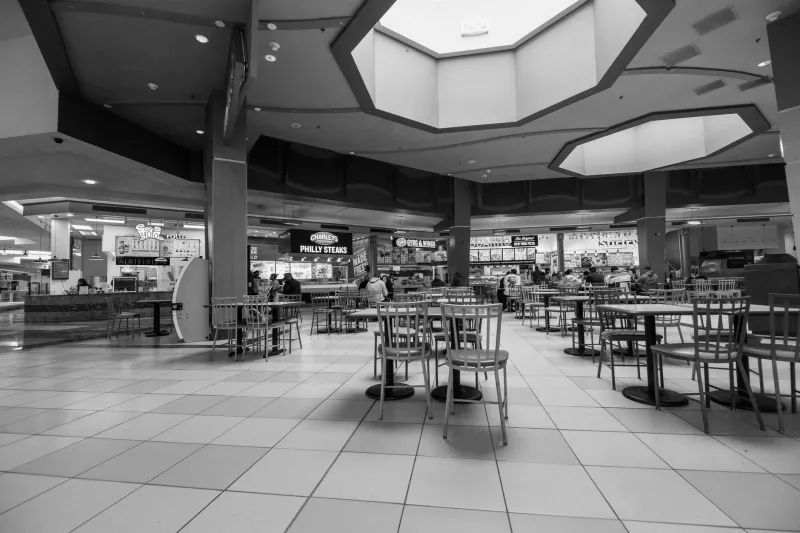 Quarters, Payphones, and Federal Agents: The Accidental Monument Emmanuel Goldstein Built in a Food Court